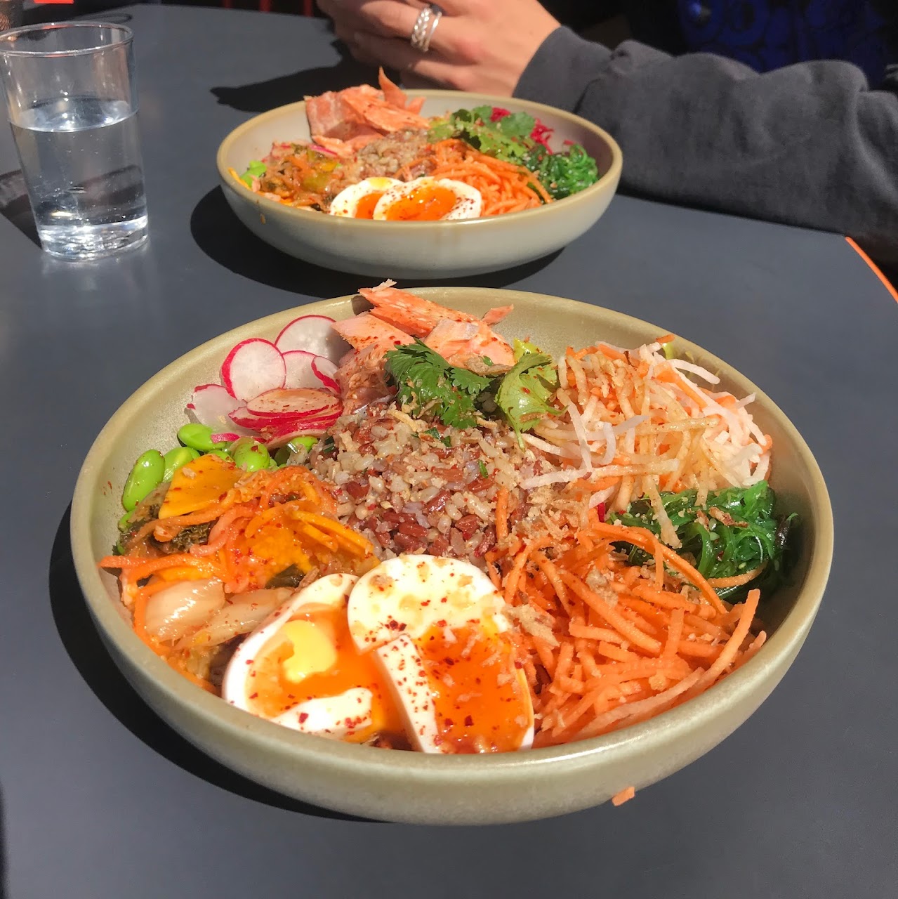 Two colourful grain bowls served at MCA Cafe